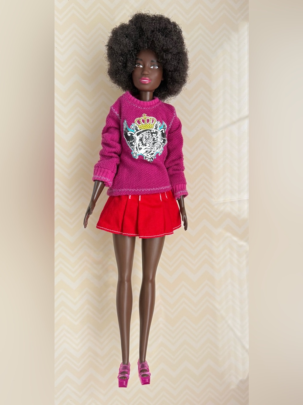 African American Barbie 2015 Magenta Sweater with Red Pleated Skirt
